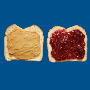 One slice of bread with peanut butter on it, and one slice of bread with red jelly on it.